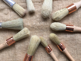 large bristle brushes for stippling wax onto canvas